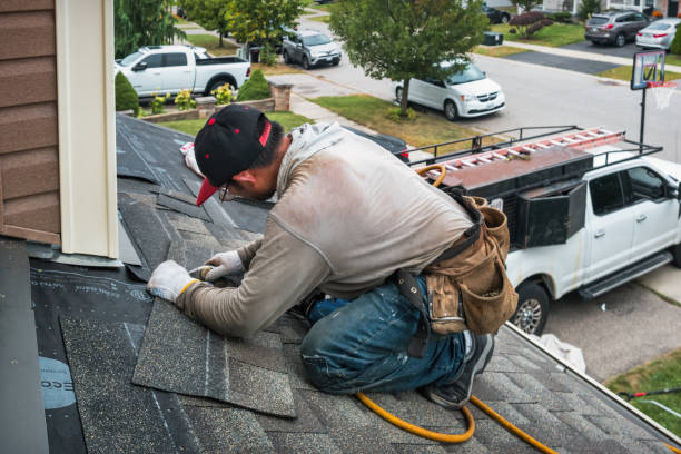 Professional Roofing technician working in Adair, IL